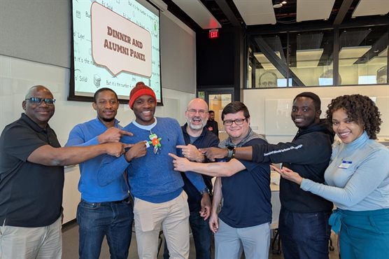 Potrait of MEP Alumni with the MEP frog.